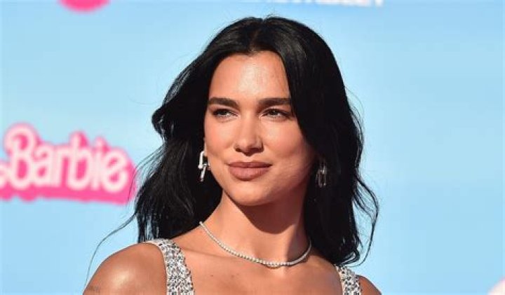 Dua Lipa Shows Off Fit Figure During 